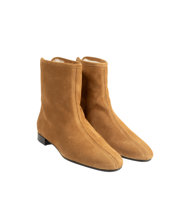 Image 2 of 4 - NEUTRAL - Toteme Women's Shearling-Lined Suede Ankle Boots are crafted from lamb suede and feature a streamlined ankle boot silhouette with a modern square toe and fold-over uppers. Designed for cold-weather wear, this refined style is enhanced by a plush shearling lining and trim, combining warmth with Toteme's signature minimalist aesthetic. Main Material: Lamb Leather Suede. Lining: Shearling. Trim: Shearling. Insole: Leather. Sole: Rubber. Includes: Shoe Box, Dust Bag. Made in Italy. 
