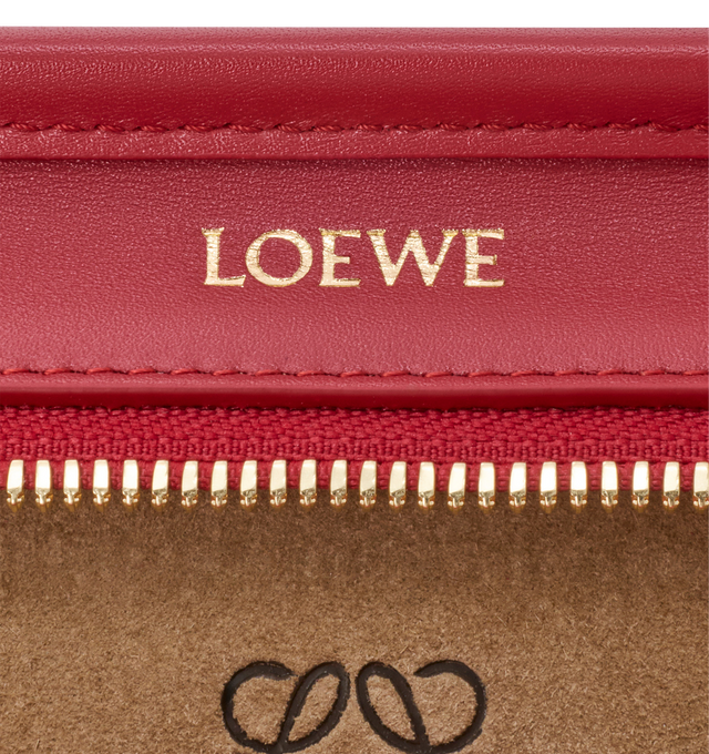 Image 14 of 18 - RED - Loewe Small Amazona 180 Bag in leather features a relaxed silhouette anchored by a single toron top handle, designed to be carried open, while a concealed closure secures the main compartment, three carry options: short handle, removable shoulder strap and crossbody, zip closure with two leather zip pullers, two compartments, main compartment closed with magnetic closure, internal flat pocket, left side d-ring for customization, nappa lambskin lining, and embossed double L branding. L 