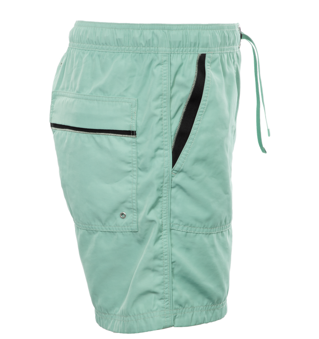 Image 3 of 4 - GREEN - STONE ISLAND Swim Trunks featuring regular fit, patch hand pockets with slanting opening edged with inner tape, back patch pocket with fixed flap and hidden zipper closure with nylon trim, Stone Island Compass patch logo on the left leg, inner mesh lining and elasticized waistband with outer drawstring set on tap tab. 100% polyester. Lining: 100% polyamide/nylon. 