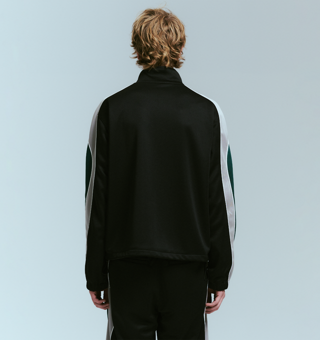 Image 4 of 4 - BLACK - NAHMIAS Ollie Track Jacket featuring zip front closure, stand collar, logo embroidery on chest, front slit pockets and stripes and piping down arms. 100% polyester.    