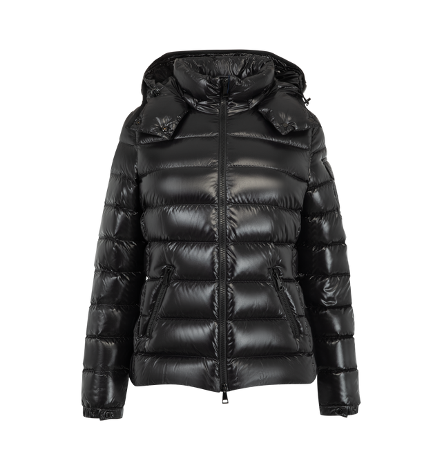 Image 1 of 1 - BLACK - Moncler Women's Bady Hooded Short Down Jacket is crafted from glossy nylon laqu and features the houses iconic boudin-quilted silhouette. A timeless Moncler design, this down-filled jacket is detailed with a detachable hood adjustable by an elastic drawstring, a front zip closure, zipped side pockets, and adjustable elastic cuffs. The signature flap patch pocket at the sleeve completes the recognizable design. Main Material: 100% Polyamide/Nylon. Lining: 100% Polyamide/Nylon. Hood Lin 