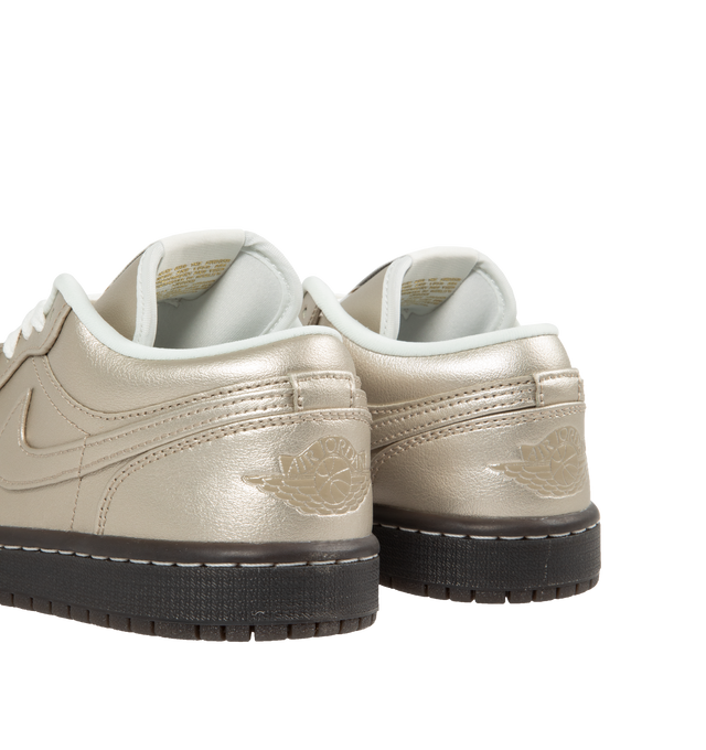 Image 3 of 5 - SILVER - Air Jordan 1 Low SE Sneakers are a lace-up style with perforated toes, Nike Air cushioning, and premium leather.  