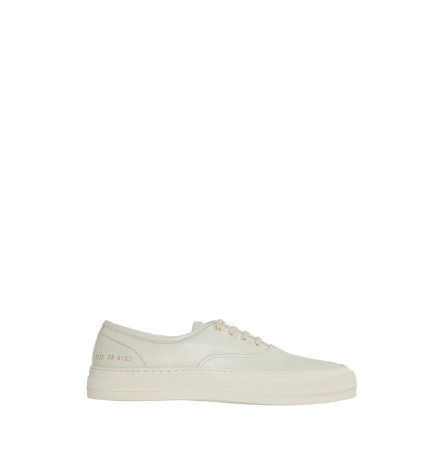 Image 1 of 5 - WHITE - Common Projects Four Hole Lace-Up Sneakers in a low-top design with flat sole, front lace-up fastening, round toe detailed with signature gold number stamp at the heel. Made in Italy. 