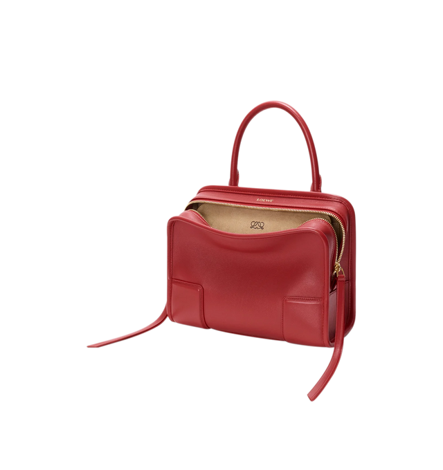 Image 6 of 18 - RED - Loewe Small Amazona 180 Bag in leather features a relaxed silhouette anchored by a single toron top handle, designed to be carried open, while a concealed closure secures the main compartment, three carry options: short handle, removable shoulder strap and crossbody, zip closure with two leather zip pullers, two compartments, main compartment closed with magnetic closure, internal flat pocket, left side d-ring for customization, nappa lambskin lining, and embossed double L branding. Le 