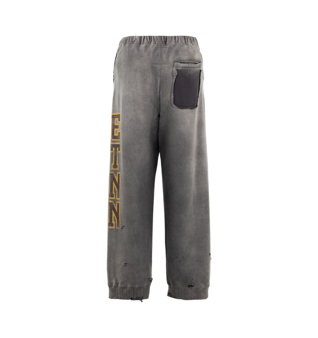 Image 2 of 3 - GREY - Maison Mihara Yasuhiro Men's Sun Faded Like Sweat Pants are crafted from cotton and feature a sun-faded appearance with bleached and distressed detailing, a college-inspired graphic print, and side pockets. Main Material: 100% Cotton. Made in Japan. 
