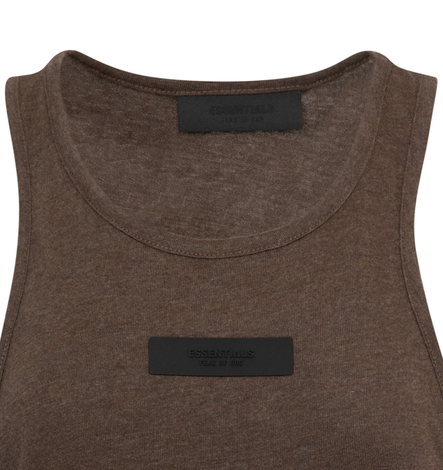Image 2 of 2 - BROWN - Fear of God Essentials tank top made in a cotton tri-blend jersey to provide softness and comfort. The U-neck tank fits relaxed in the body with dropped arm holes. New minimalist branding is seen in the rubberized Essentials Fear of God black bar on the center front. 53% cotton, 40% polyester, 7% rayon. 