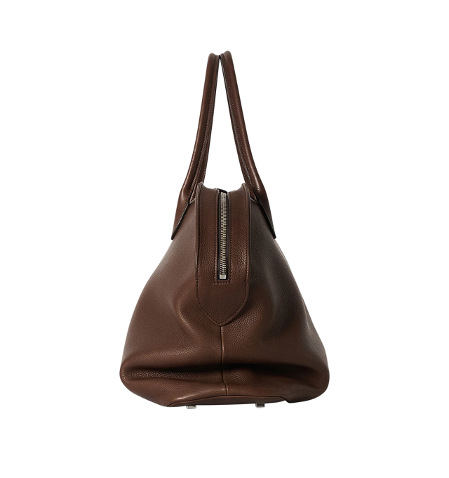Image 3 of 3 - BROWN - THE ROW Agnes 15 Bag featuring softly structured top-handle bag in grained saddle leather with tubular handles, gusseted side folds, flat base, and curved top zipper closure. 17.52 x 9.85 x 8.66 in. 100% calfskin leather. Made in Italy. 