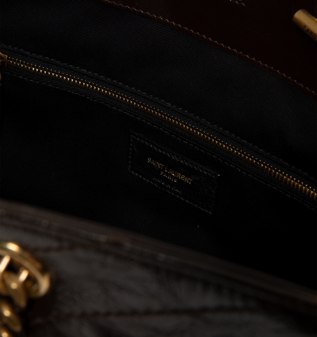Image 3 of 3 - BROWN - Saint Laurent Niki Shopping Bag in vintage leather featuring chevron topstitching, cotton lining, bronze-tone hardware, magnetic snap-button closure and one zip pocket making it ideal for work, travel, or day-to-day use. Dimensions: 13" x 10.6" x 5.5". Strap drop: 10.6". Fits everyday essentials such as a 13" laptop, tablet, wallet, phone, sunglasses, keys, and a small pouch. Main Material: Calfskin Leather. Made in Italy.  
