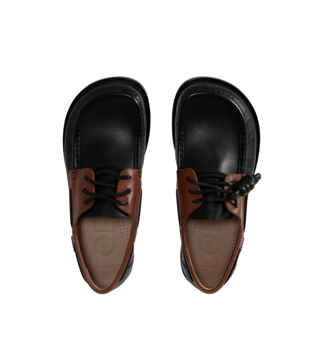 Image 4 of 4 - BROWN - Loewe Men's Campo Boat shoe in two-tone soft calfskin featuring the LOEWE signature round toe shape and a hand-sewn construction with a supple leather lining and flexible sole. Features 20mm heel, squared leather lace closure, padded leather insole, rubber-injected leather outsole, removable Flamenco knot and LOEWE embossed tag placed at the side. Made in Italy. 