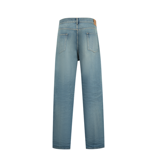 Image 2 of 3 - BLUE - Saint Laurent Men's Relaxed Tapered Jeans are crafted from certified cotton and feature a mid-rise waist, relaxed tapered leg, center crease, button fly, five-pocket styling, belt loops, and a Saint Laurent Paris embossed leather jacron. This designer denim combines modern tailoring with signature Saint Laurent detailing for elevated everyday wear. Main Material: Cotton. Made in Japan. 