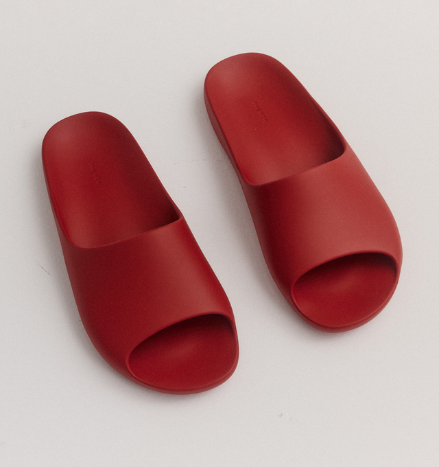 Image 2 of 5 - RED - THE ROW Ama Slide featuring smoothly curved slide sandal in lightweight rubber with contoured footbed and seamless construction. 100% rubber. Made in Italy. 