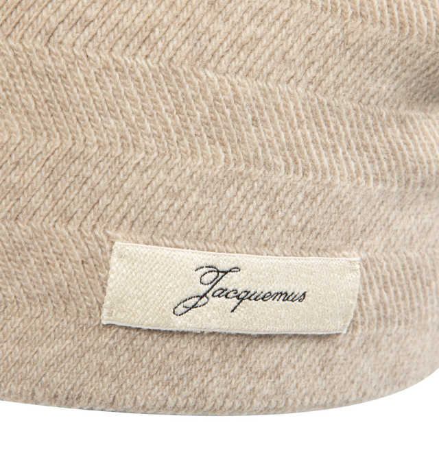 Image 3 of 3 - CHAMPAGNE - JACQUEMUS Chevron Knit Beanie in wool and cashmere featuring chevron pattern knit, unfolded shape and logo tag embroidered on the side. 70% virgin wool, 30% cashmere. Made in Italy. 