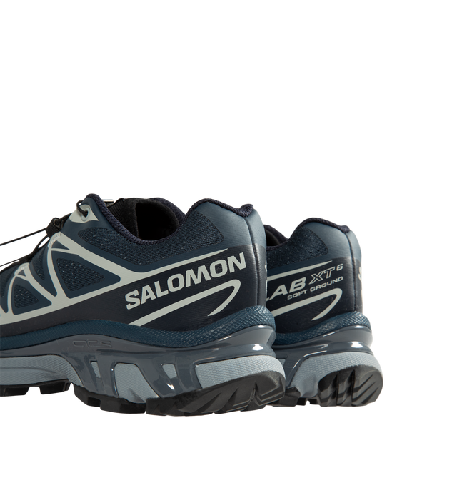 Image 3 of 5 - BLUE - Salomon Unisex XT-6 Steel Streets Sneakers are crafted from synthetic and textile materials and feature the iconic XT-6 silhouette reimagined with reflective metallic yarn and 3D mesh construction. Inspired by the raw energy of the city, this modern update enhances the model's signature SensiFit technology with a metallic finish, delivering a bold, high-shine look while maintaining the performance features that made the XT-6 a trail-running staple. Main Material: Synthetic and Textile  