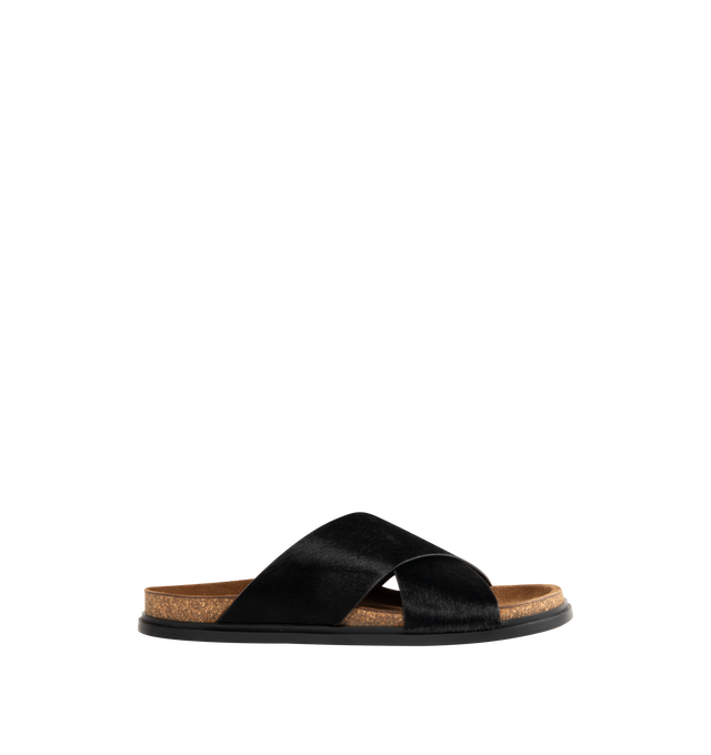 Image 1 of 4 - BLACK - The Row flat sandal in textured pony hair leather with wide overlapped upper straps, contoured cork footbed, and rubber sole. 100% Calfskin Leather. Made in Italy. 