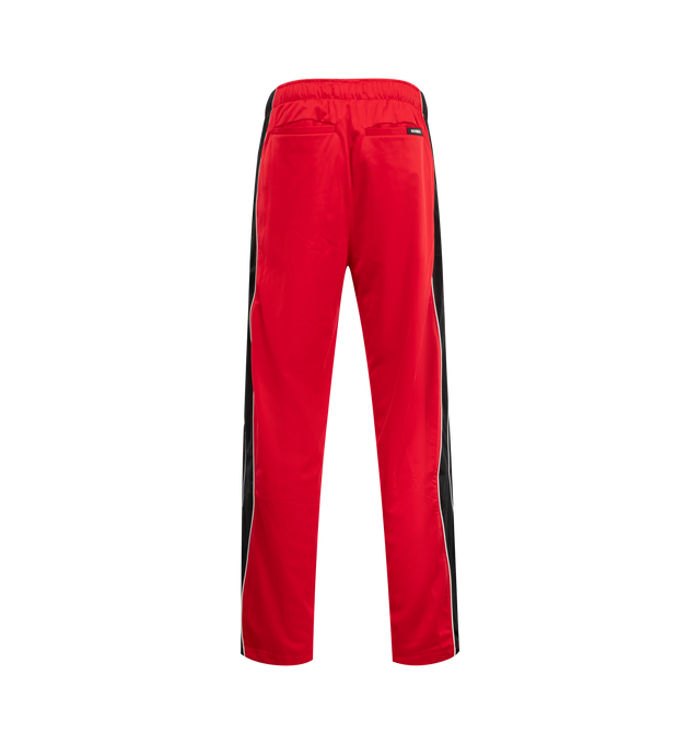 Image 2 of 3 - RED - NAHMIAS Ollie Sweatpants featuring relaxed fit, elasticated waistband, side pockets, embroidered logo and drawstring closure. 100% nylon. 