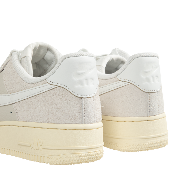 Image 3 of 5 - WHITE - Nike Air Force 1 '07 LX Sneakers lace-up style with tumbled leather and shaggy suede textural upper, Coconut Milk sidewalls and outsole with crisp Summit White Swoosh logos, stitched overlays, Nike Air cushioning, padded collars, foam midsoles, and rubber soles. 