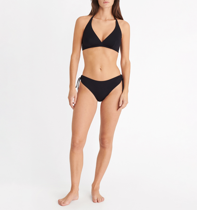 Image 2 of 5 - BLACK - ERES Never Thin Bikini Briefs featuring adjustable spaghetti straps connected by a round link on each side with branded tips, side shirring and indented in the front and back. 84% Polyamid, 16% Spandex. Made in Morocco.  