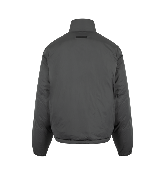 Image 2 of 3 - GREY - FEAR OF GOD ESSENTIALS Ripstop Nylon Puffer Jacket featuring ripstop nylon, matte appearance with water repellant properties, 3D Essentials  graphic on the chest, relaxed, rounded silhouette, high neck, side pockets, full zip front, elasticized piping on the cuffs and waist hem, bungee toggles at the waist hem for adjustable styling and a Fear of God Essentials rubberized label stitched at the back collar. 100% matte nylon. 