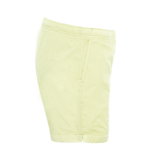 Image 3 of 3 - GREEN - C.P. COMPANY Eco-Chrome R Swim Shorts featuring tonal stitching, two side slash pockets, logo patch to the leg, short side slits, thigh-length, mesh lining and elasticated waistband with internal drawstring. 100% polyamide. 