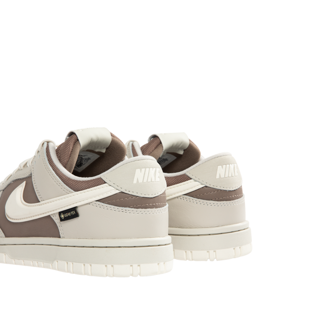 Image 3 of 5 - BROWN - NIKE Dunk Low GORE-TEX Sneaker featuring waterproof GORE-TEX finish, low-cut silhouette, reflective-design detail, padded collar, foam midsole and rubber outsole with classic pivot circle. 