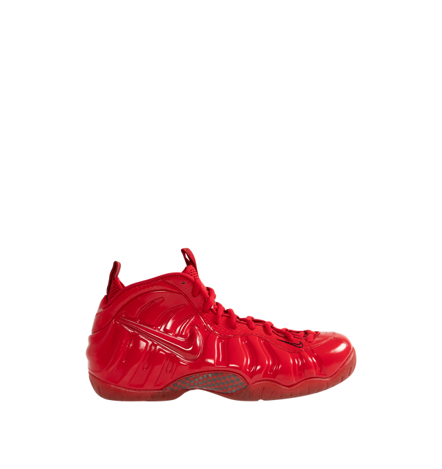 Image 1 of 5 - RED - NIKE Air Foamposite Pro Sneaker featuring Foamposite upper that molds to your foot, full-length and heel Zoom Air cushioning, foam midsole and rubber outsole with herringbone tread. 