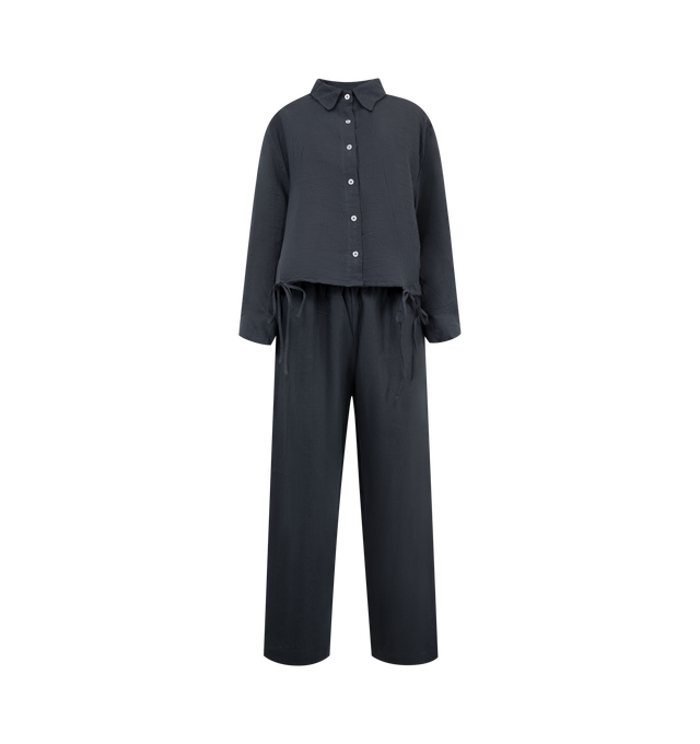 Image 1 of 6 - BLUE - DEIJI STUDIOS Tie Hem Linen Set featuring organic stone washed French linen, this classic button-up shirt and straight leg pant set features tie closures, a relaxed fit, and can be worn together or separately. Shirt: button front closure, splits at side seams with tie closure; relaxed, oversized fit. Pant: straight leg fit, elastic waistband, side seam pockets. 100% GOTS certified organic. 
