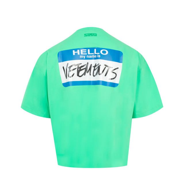 Image 2 of 2 - GREEN - Vetements My Name Label Cropped T-Shirt has a crew neck, dropped shoulders, a cropped hem, and a logo printed at the chest and on the back. 100% cotton. Made in Portugal.  