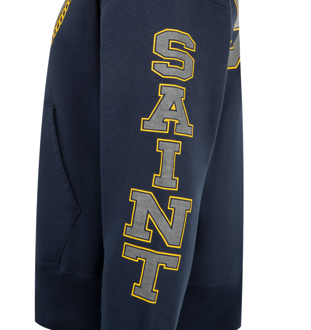 Image 3 of 3 - NAVY - SAINT MICHAEL Saint Hoodie featuring fixed hood, ribbed hem and cuffs, front pocket and graphic on front. 100% cotton. Made in Japan. 