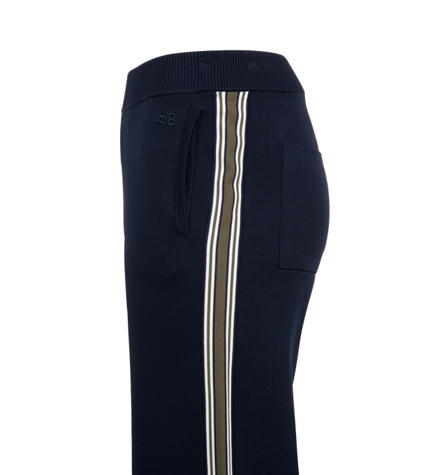 Image 3 of 3 - WHITE - Wales Bonner Tide Track Pants featuring knit viscose-blend, rib-knit elasticized waistband, four-pocket styling, logo embroidered at front and stripes at outseams. 75% viscose, 23% polyester, 2% nylon. 