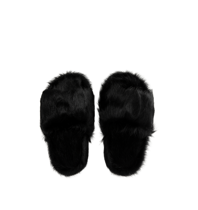 Image 4 of 4 - BLACK - Rick Owens Men's Chancla Sandals are crafted from unshaved cow leather and feature an oversized flip-flop silhouette with a wide strap across the top of the foot and a rounded toe. Designed in the FW26 Tower collection, the style showcases a distinctive hair-on leather finish with an irregular melange coloration created through a specialized corrosion treatment. Main Material: 100% Cow Hair-On Leather. Lining: 100% Calf Leather. Padding: 100% Polyester. Footbed: 100% Cow Hair-On Leath 