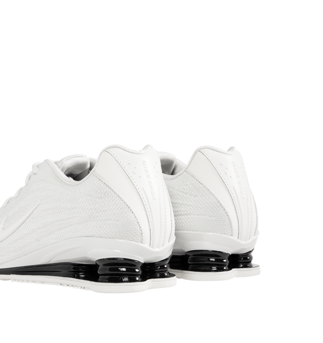 Image 3 of 5 - WHITE - NIKE Shox Z Sneaker featuring textile upper with rubber sole, lace-up front, cushioned textile footbed and lining, signature Swoosh at outer panels and modern low-profile with compressed heel columns. 