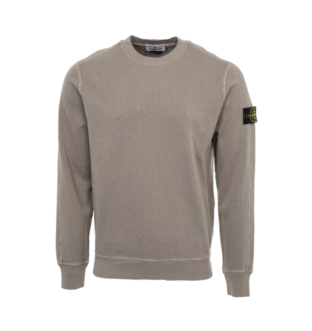 Image 1 of 3 - GREY - STONE ISLAND Crewneck Sweatshirt featuring rib knit crewneck, hem, and cuffs and detachable logo patch at sleeve. 100% cotton. Made in Turkey. 