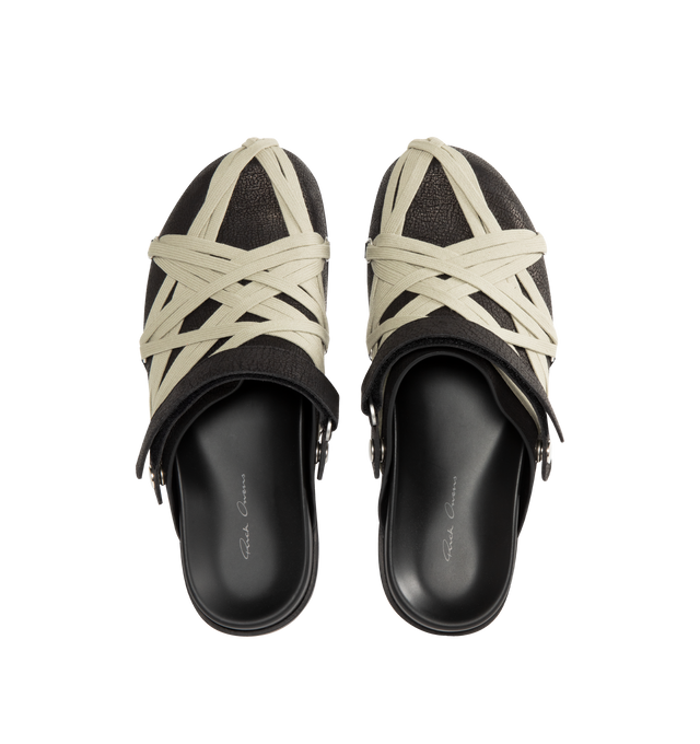 Image 4 of 4 - BLACK - Rick Owens Men's Megalace Granola Mules crafted from medium weight cracked calf leather. Slip-on covered style featuring an open back with adjustable strap,  sculpted footbed, sharktooth sole and signature mega-lacing detail in a pentagram shape covering the front. 100% calf leather upper and lining, cow leather sole with rubber detail. Made in Italy. 