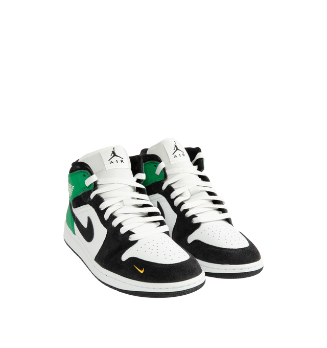 Image 2 of 5 - GREEN - Men's Air Jordan 1 Mid SE Sneakers feature a genuine leather upper with the iconic mid-top silhouette, signature Wings branding, and a stitched Swoosh for a timeless heritage look. These lifestyle sneakers combine encapsulated Air-Sole cushioning, a padded collar, and a durable rubber outsole for lightweight comfort, lasting support, and reliable traction. Main Material: Genuine Leather. Midsole: Encapsulated Air-Sole Unit. Sole: Rubber. 
