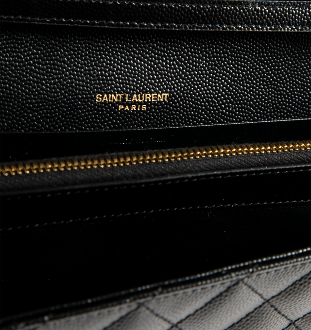 Image 3 of 3 - BLACK - SAINT LAURENT Envelope Triquilt Wallet on Chain in Grained Leather featuring matelass grain de poudre embossed leather with metal YSL monogram detail, detachable leather/chain crossbody strap, flap top with snap closure, golden hardware, center zip divides interior, 10 card slots, one bill compartment and leather lining. 5.5"H x 8.8"W x 1.5"D. Made in Italy. 