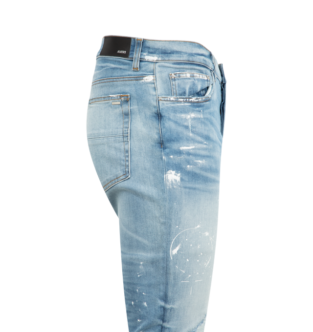 Image 3 of 3 - BLUE - AMIRI Painter Denim MX1 Jeans featuring destroyed light-wash denim, regular rise, five-pocket style, fitted through skinny legs, button zip fly and belt loops. Cotton/elastane. Made in Italy. 