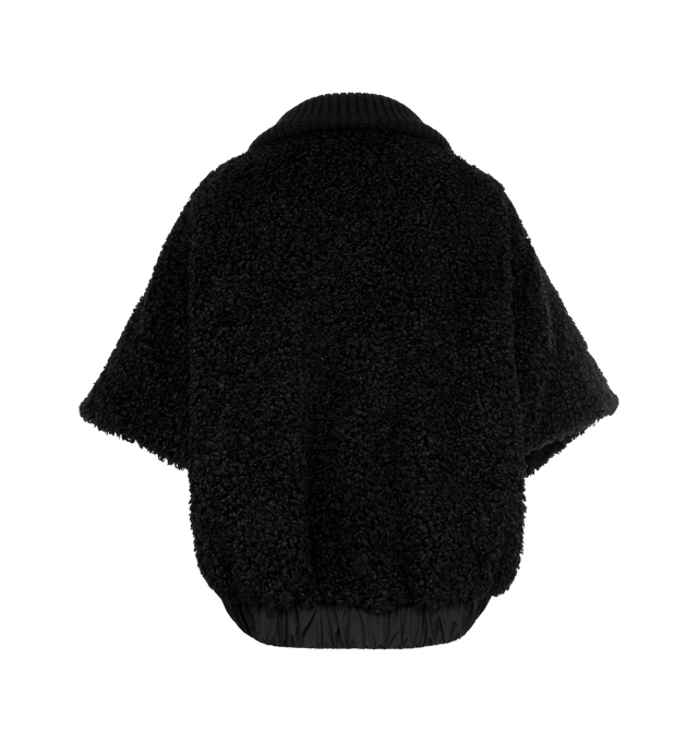 Image 2 of 4 - BLACK - MONCLER Reversible Faux Fur Cape featuring chunky knit collar, two-way zip-front, raglan sleeves, tonal leather logo patch on the left sleeve, relaxed fit, elasticized hem and reverses to a water-resistant recycled polyester. Polyester/leather. Lining: nylon. 