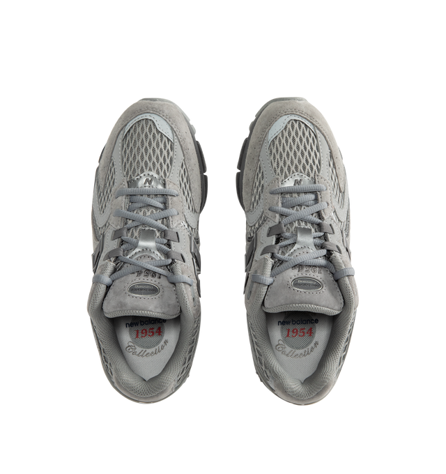Image 5 of 5 - GREY - New Balance 1954R Unisex Sneakers feature a suede and mesh upper inspired by the 2002 and 1906 models, combining breathable mesh with synthetic and pig suede overlays. ABZORB midsole cushioning absorbs impact through a combination of cushioning and compression resistance, while a traditional lace-up closure provides an adjustable fit. Upper: Synthetic, Mesh, and Pig Suede.  