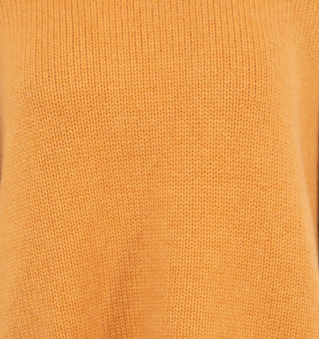 Image 3 of 3 - ORANGE - GUEST IN RESIDENCE Cozy Crew featuring oversized fit, crew neck, dropped shoulder, reverse jersey detail around arm & shoulder with tuck stitch, ribbed neck trim, cuff and hem, side slit at hem and jersey cable. 100% cashmere.  