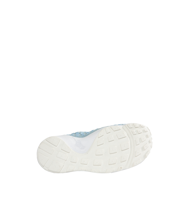 Image 4 of 5 - BLUE - NIKE Air Footscape Woven Sneakers featuring a pale blue colored textile and soft suede upper, asymmetrical woven details, lateral lacing, foam midsole, Nike Air cushioned heel and rubber outsole. 