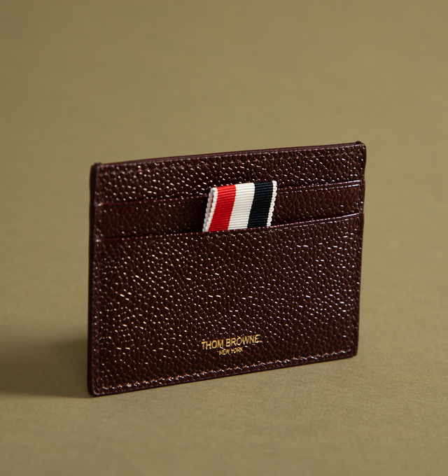 Image 2 of 4 - BROWN - Thom Browne signature card holder in rich, luxe lucido leather featuring 2 card slots, 1 note compartment, tricolor stripe lining, gold foil logo and signature striped grosgrain loop tab. 100% Calf Full Grain Leather.  Lining: 68% Polyester Recycled, 27% Polyester, 5% Acrylic. Made in Italy. 