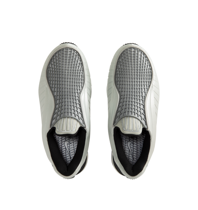 Image 5 of 5 - SILVER - Nike Women's Air Max Dolce features a laceless molded upper with an overlay cage and the signature Air Max silhouette. This streamlined design is detailed with visible Air cushioning in the heel for comfort and a distinctive profile. Designed as a versatile slip-on style. Upper: 70% Calf Leather, 15% Patent Calf Leather, 15% Fabric. Lining: 100% Fabric. Sole: 100% Rubber. 