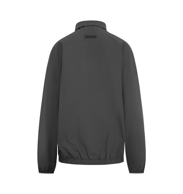Image 2 of 3 - GREY - FEAR OF GOD ESSENTIALS Nylon Half Zip Track Jacket featuring nylon-spandex, detailed with an metallic 3M-printed Essentials  graphic on the sleeves, relaxed, rounded silhouette, high neck, half-zip front, elasticized cuffs and waist hem and a Fear of God Essentials rubberized label stitched at the back. 84% nylon, 16% spandex. 