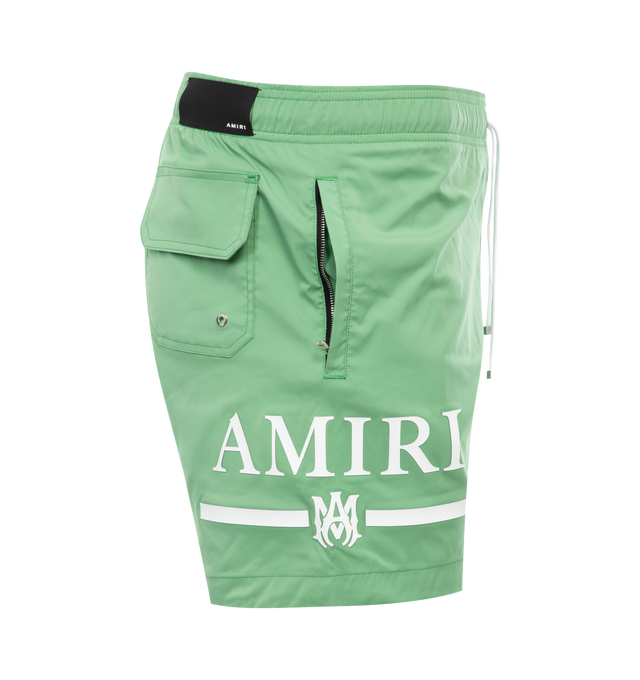 Image 3 of 3 - GREEN - AMIRI MA Bar Logo Swim Trunk featuring drawcord at waist, logo at leg, cover back patch pocket, zipped side pockets and classic fit. 90% polyester, 10% spandex. 