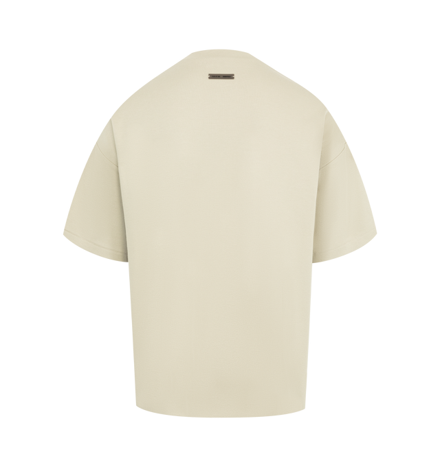 Image 2 of 2 - NEUTRAL - FEAR OF GOD ESSENTIALS Pique 90's Short Sleeve Tee made from medium-weight cotton/poly pique knit featuring a 90s fit with oversized proportions and dropped shoulders. Minimalist branding includes a Fear of God Essentials rubberized label on the center front and the back collar. 100% cotton. 