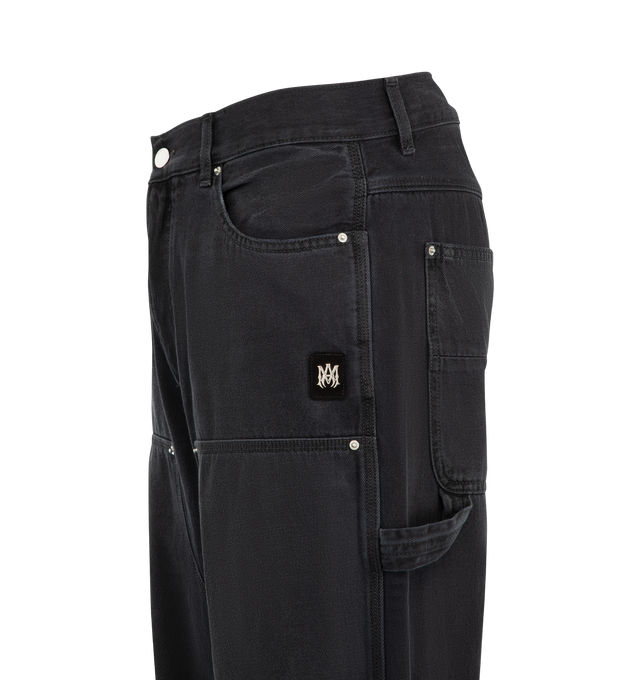 Image 4 of 4 - BLACK - Amiri Mens Lightweight Cotton Carpenter Jeans are crafted from cotton denim with lived-in washed and riveted front patches. Features a classic five-pocket construction, front patch panels, carpenter hammer loop, and zip-fly with button closure. Main Material: 100% Cotton. Made in Italy. 