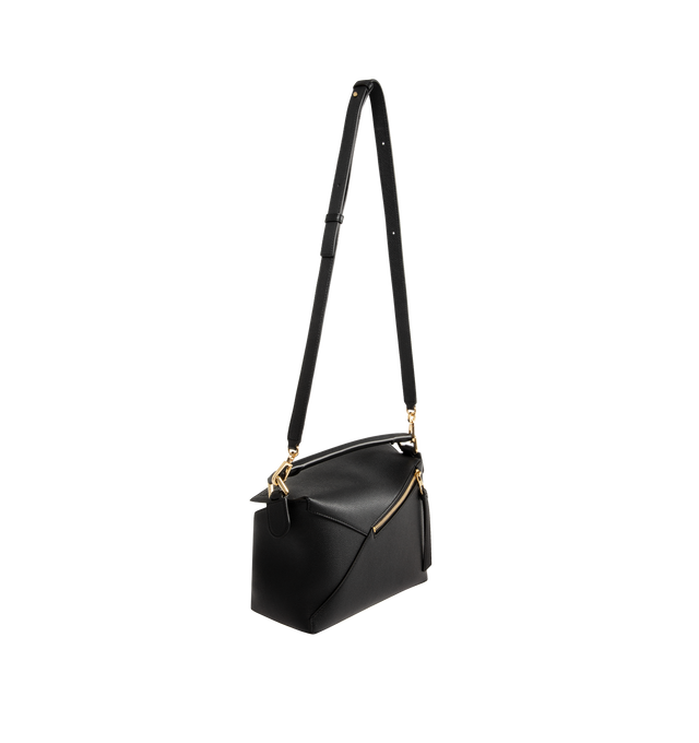 Image 2 of 3 - BLACK - LOEWE Small Puzzle Edge Bag in soft grained calfskin featuring geometric lines, cuboid form, overlapped panels with single stitch lines, shoulder, crossbody or hand carry, detachable and adjustable strap, zip closure with calfskin pull, one external zip rear pocket, one internal slip pocket, herringbone cotton canvas lining and embossed Anagram. Soft grained calf. 16.5 cm x 24 cm x 10.5 cm. Made in Spain. 