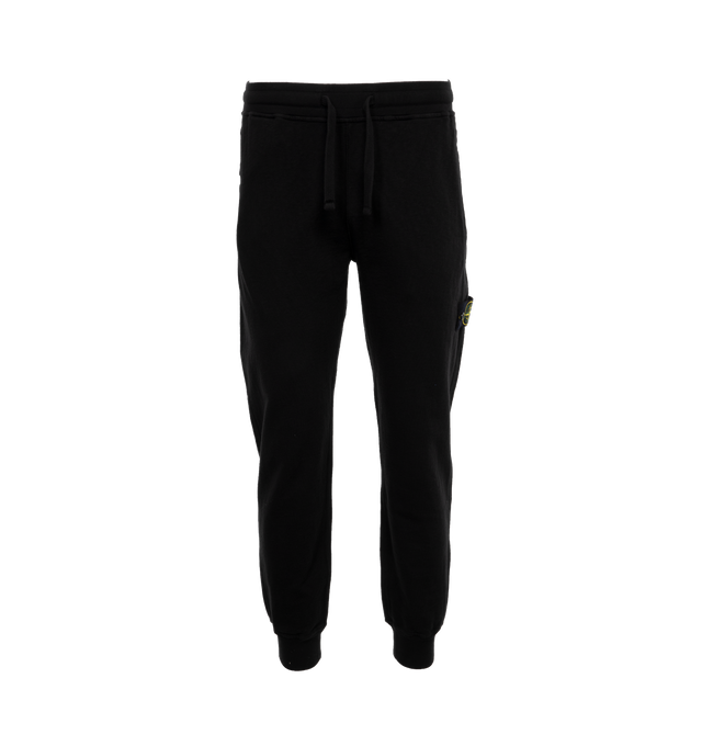 Image 1 of 4 - BLACK - STONE ISLAND Fleece Sweatpants featuring elasticized drawstring waistband, side-seam pockets, side zip pocket, back zip welt pocket and rib-knit cuffs. 100% cotton. 