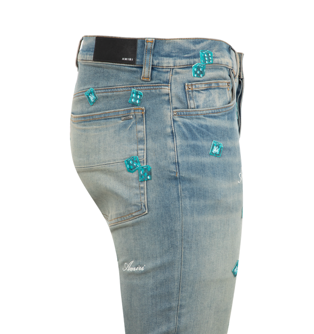 Image 3 of 3 - BLUE - Amiri Dice Skinny Jeans are a 5-pocket style designed in Italian stretch denim with embroidered dice and the house script logo. 92% cotton, 6% elastomultiester, 2% elastane. Made in USA.  