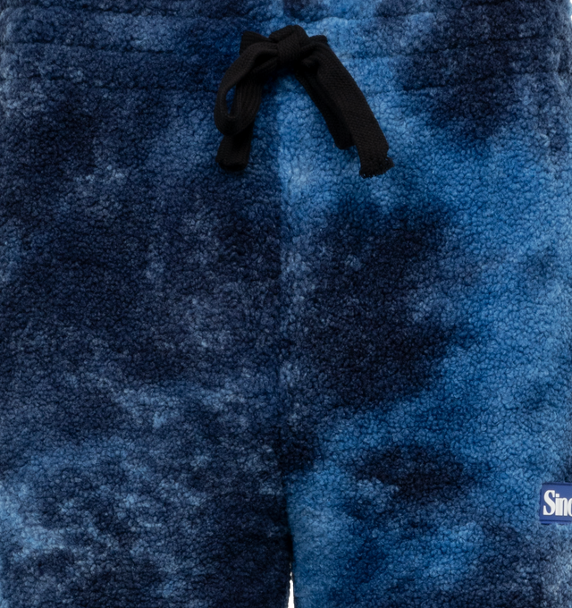 BLUE - SINCLAIR GLOBAL Tie Dye Cozy Sweatpants featuring a chic tie-dye design, relaxed fit and elastic waistband.